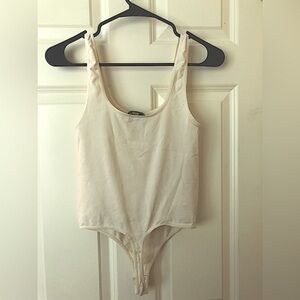 Bebe bodysuit light cream color size S